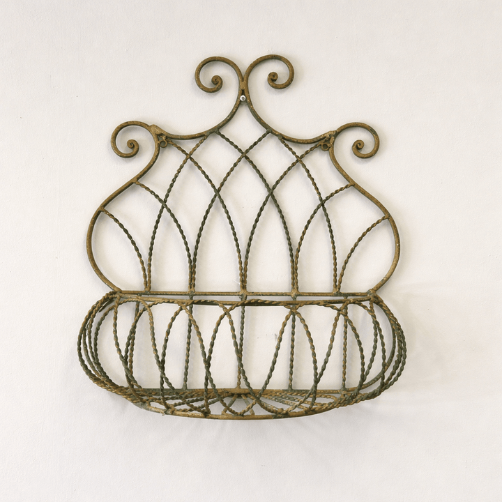 Vintage Wrought Iron Wall Basket Planter with Scrollwork Design for rustic garden style