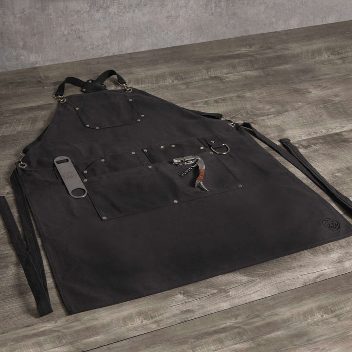 Waxed Canvas Bartender Apron and Tools displayed on wooden surface