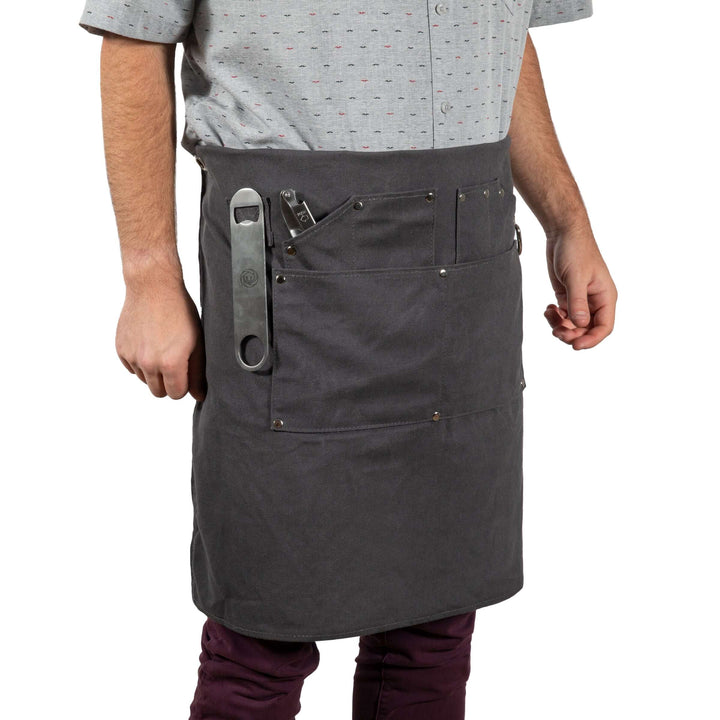 Man wearing Waxed Canvas Bartender Apron and Tools, showcasing durable design for professional mixology use.