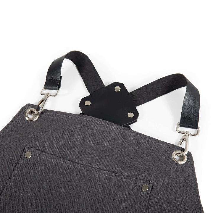 Close-up of Waxed Canvas Bartender Apron showing straps and durable fabric design for mixology professionals.