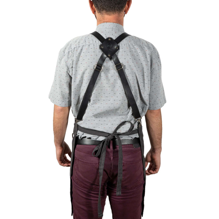 Person wearing the Waxed Canvas Bartender Apron and Tools, showcasing the durable strap design from behind.