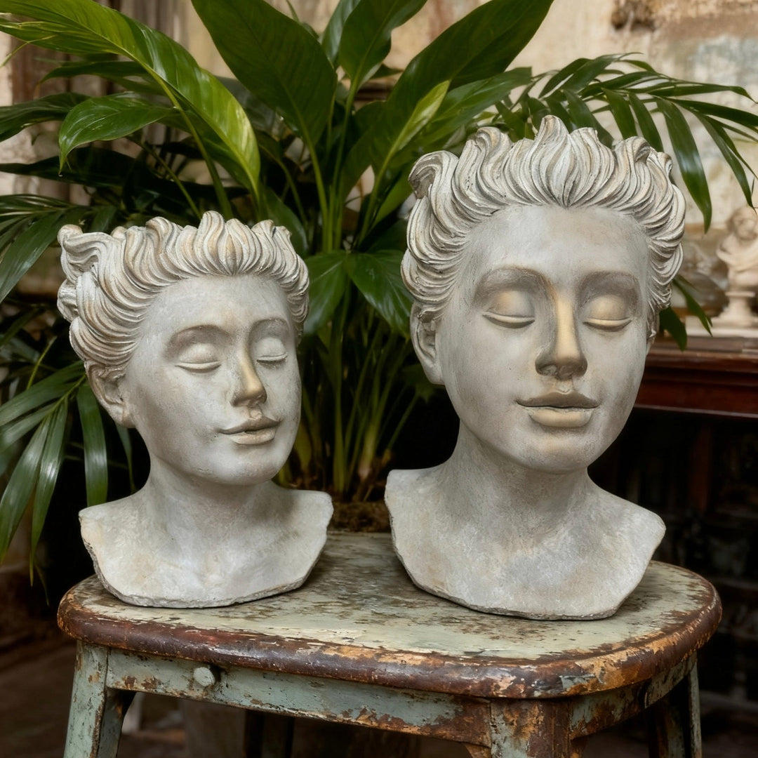Front view of two Weathered Roman Bust Planter sizes with classical portrait details