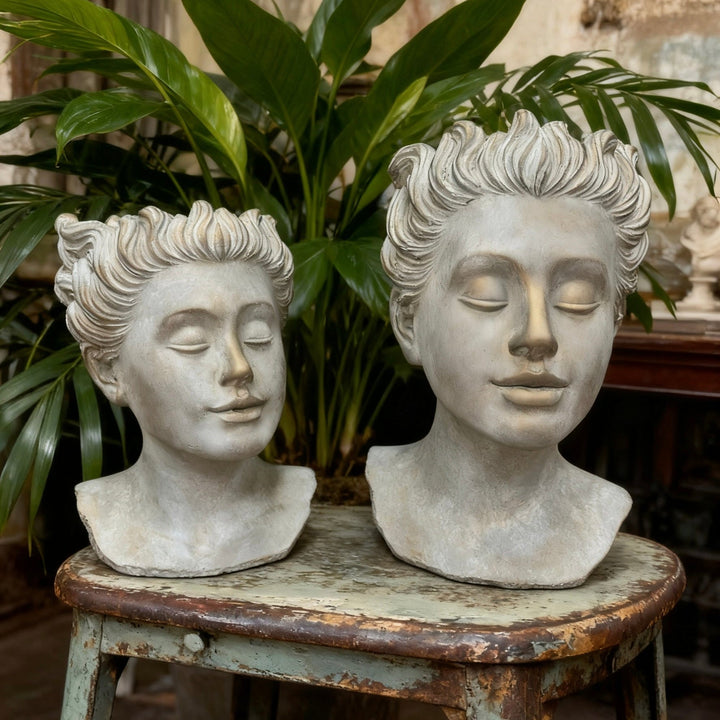 Front view of two Weathered Roman Bust Planter sizes with classical portrait details