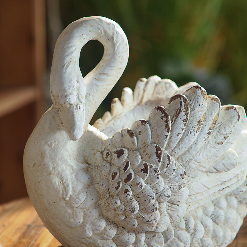 Close view of feather detailing on a Weathered Swan Garden Planter