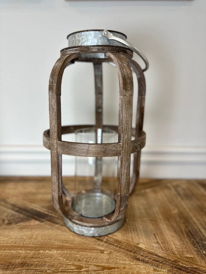 Weathered wood lantern with clear glass hurricane and galvanized metal top