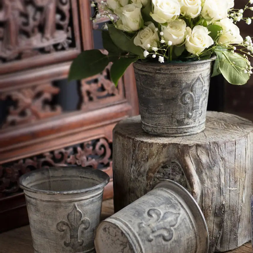 Weathered Zinc Fleur-de-Lis Flower Pots styled with white roses