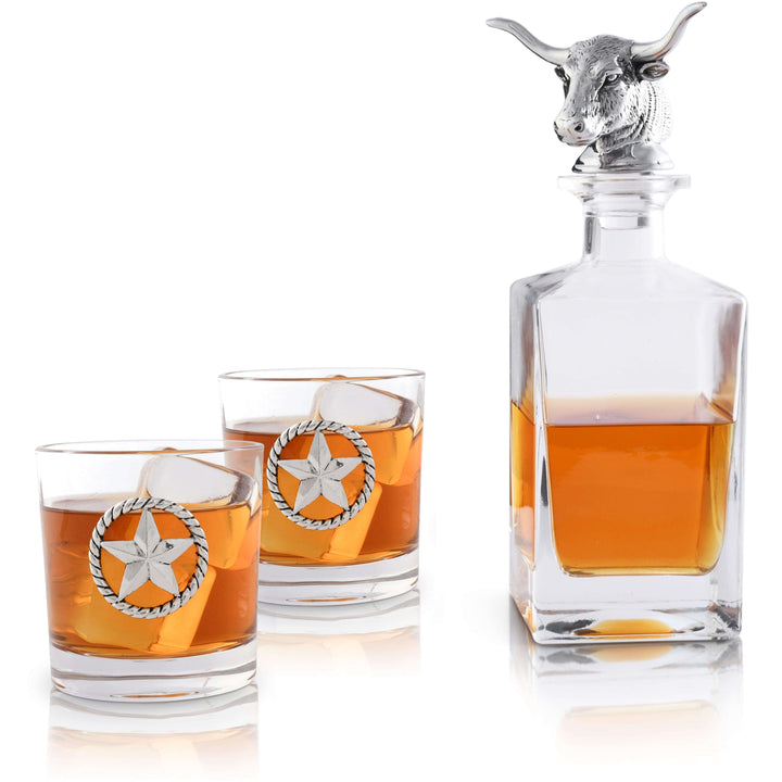 Western Longhorn Whiskey Decanter Set with Glasses featuring bull head stopper and star-emblazoned glasses filled with whiskey.