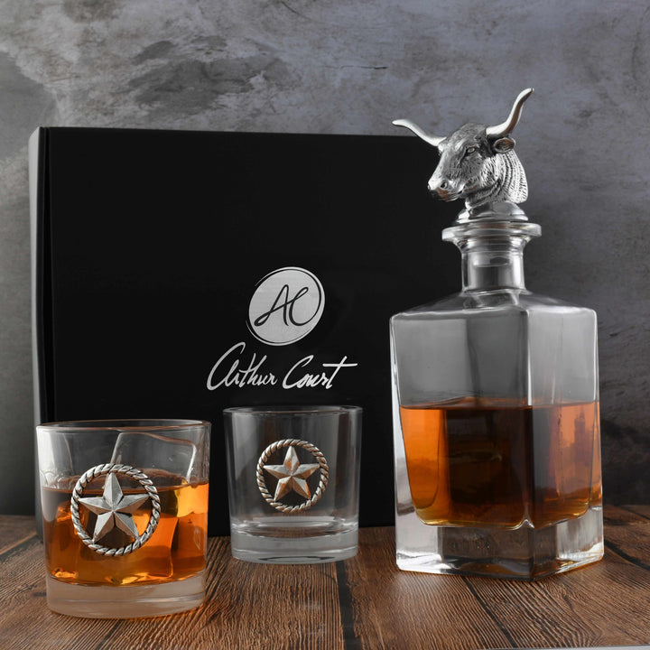 Western Longhorn Whiskey Decanter Set with Glasses featuring a bull head stopper, rustic elegance, and star-embellished glasses.