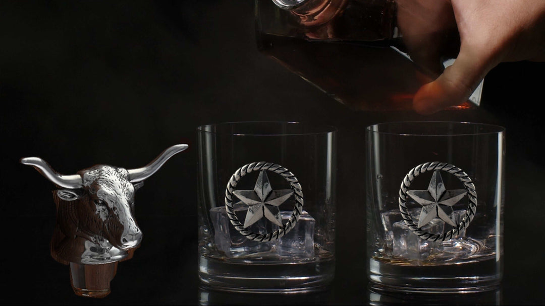 Western Longhorn Whiskey Decanter Set with Glasses featuring bull head stopper and two whiskey glasses with star design.