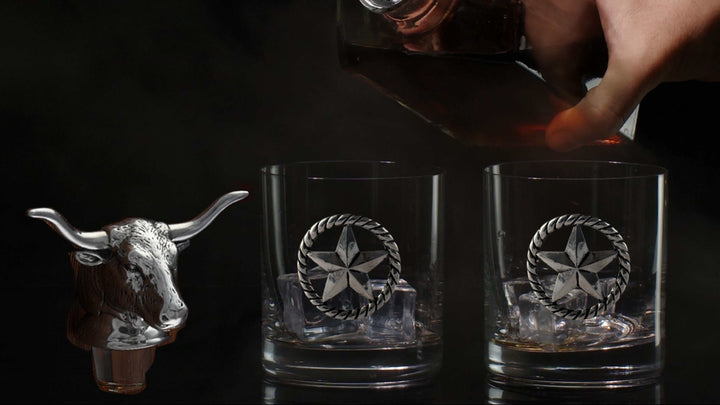 Western Longhorn Whiskey Decanter Set with Glasses featuring bull head stopper and two whiskey glasses with star design.