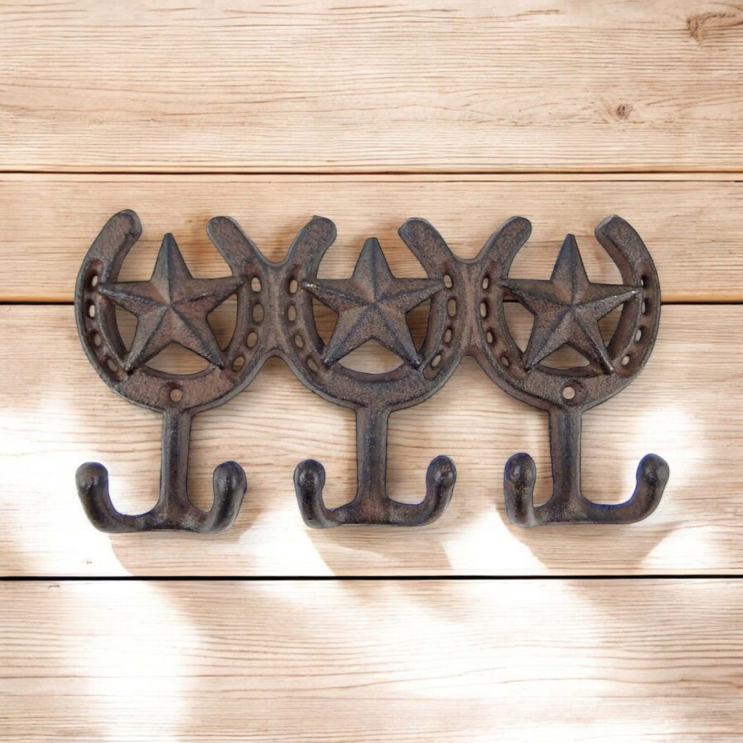 Western Cast Iron Horseshoe Hook Rack with star design on wooden background