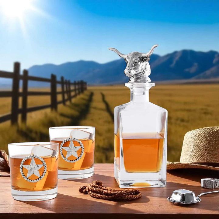 Western Longhorn Whiskey Decanter Set with Glasses in rustic outdoor setting
