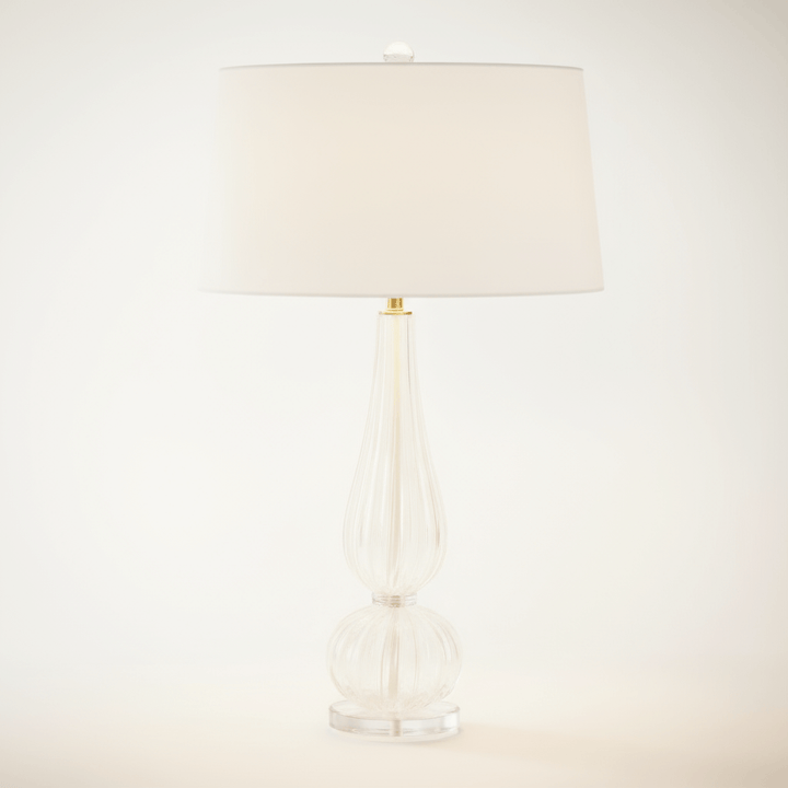 Table lamp with a beige shade on a white background