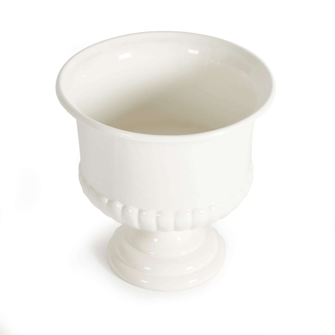 White ceramic urn planter for Tuscan-inspired decor with a classic flared rim and pedestal base.