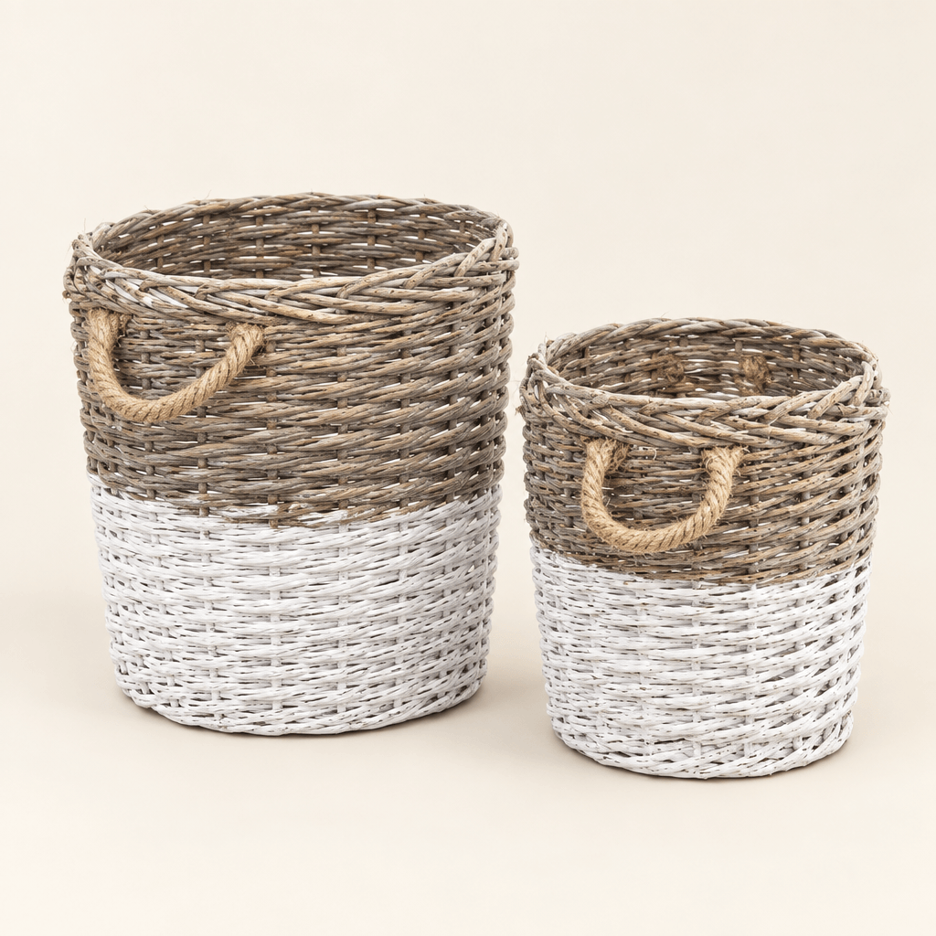 Two White-Dipped Willow Baskets with rope handles on an ivory background