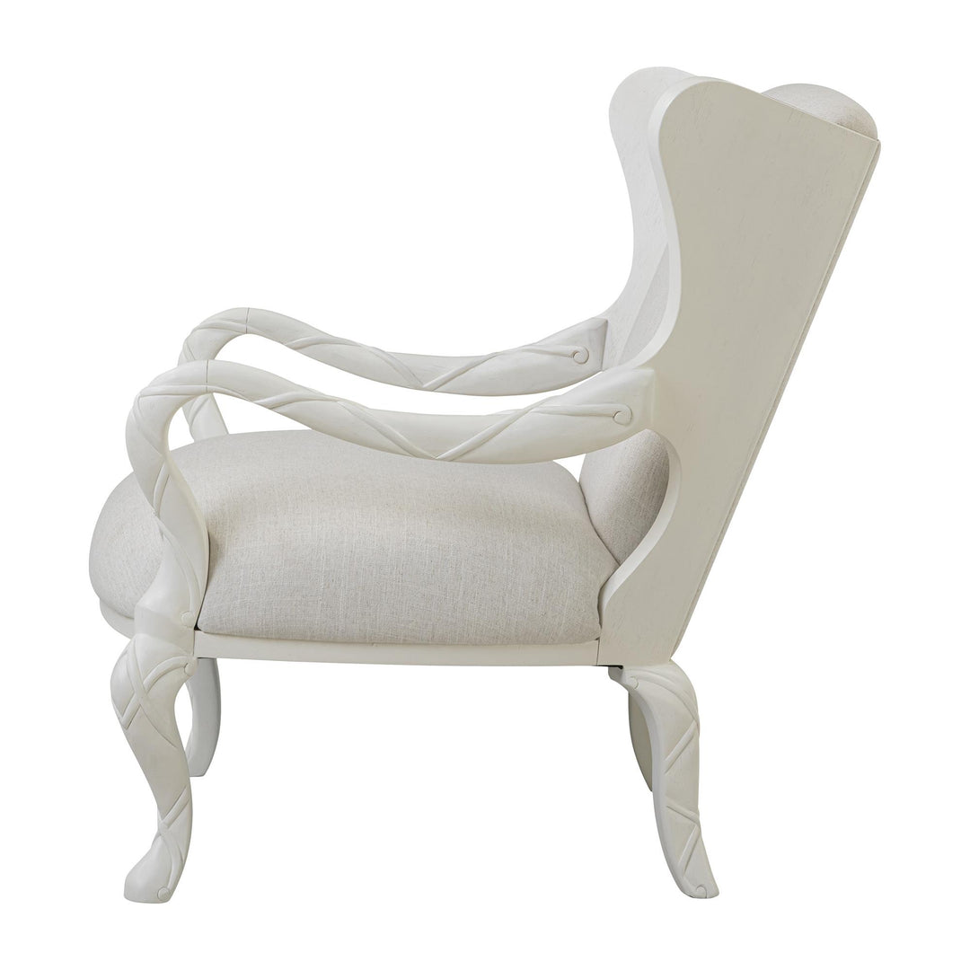 Side view of the ribbon wing chair showing the open curved arm and seat profile.