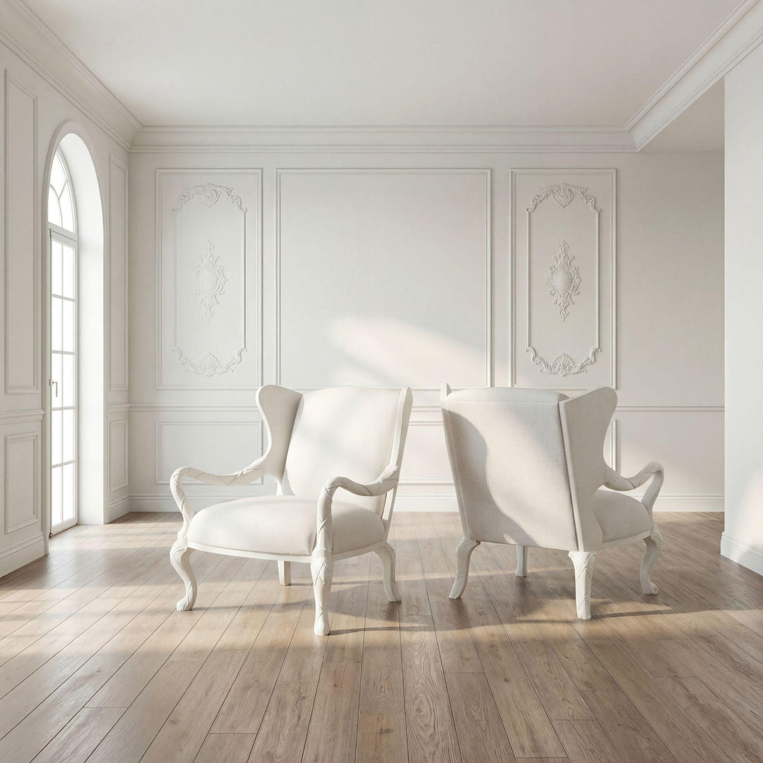 Room setting with whitewash ribbon chairs in a pale paneled interior; chairs sold individually.