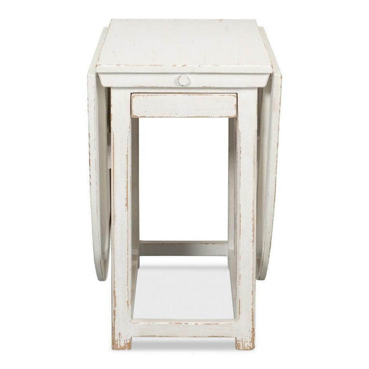 Whitewashed Vintage Dropleaf Table with Distressed Wood Finish, featuring a rustic farmhouse design, ideal for elegant dining spaces.