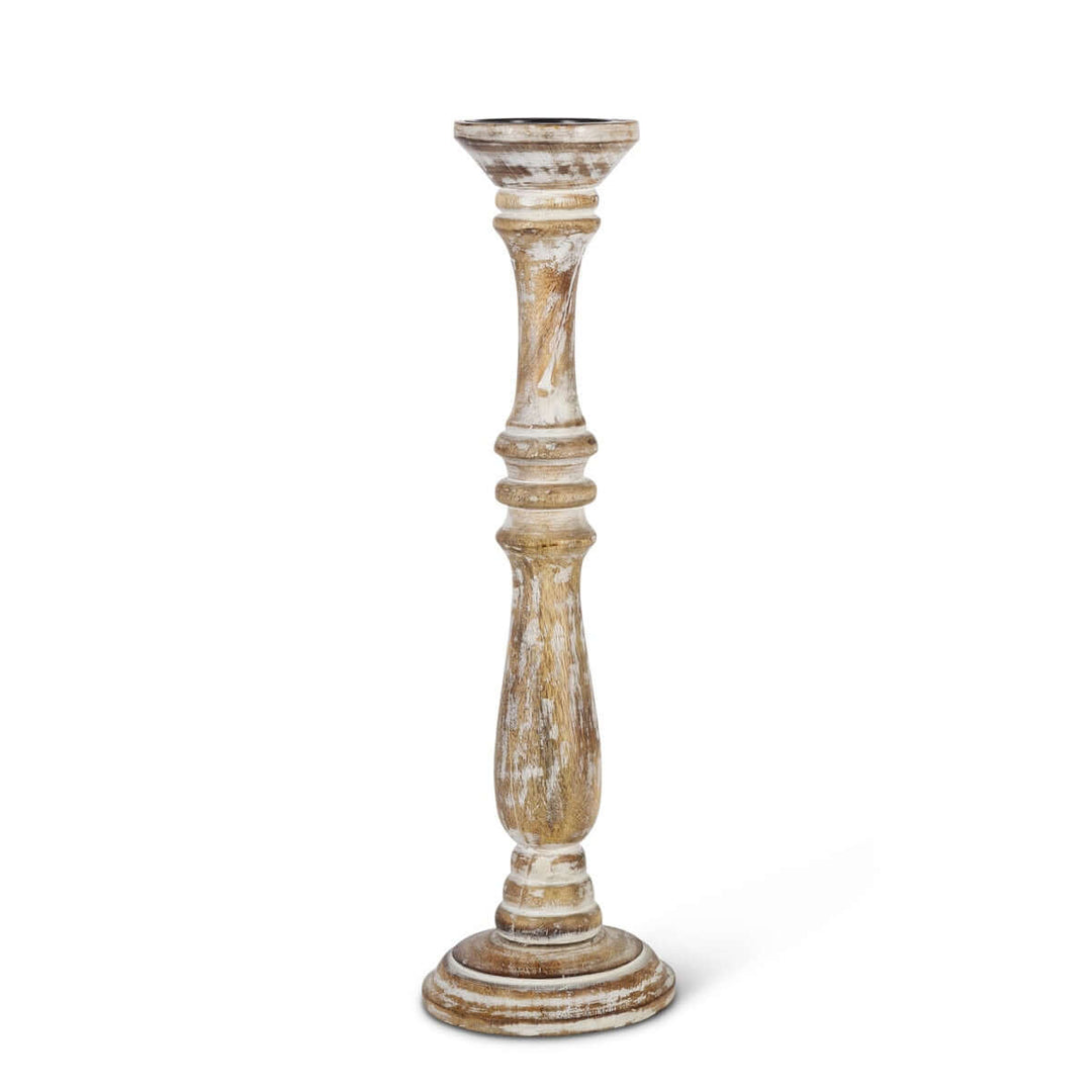 Whitewashed mango wood candle holder with a tall, turned silhouette and distressed finish, showcasing traditional craftsmanship.