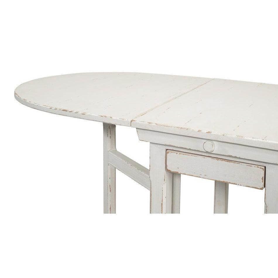 Whitewashed Vintage Dropleaf Table with Distressed Wood Finish with elegant farmhouse design and versatile folding leaves.