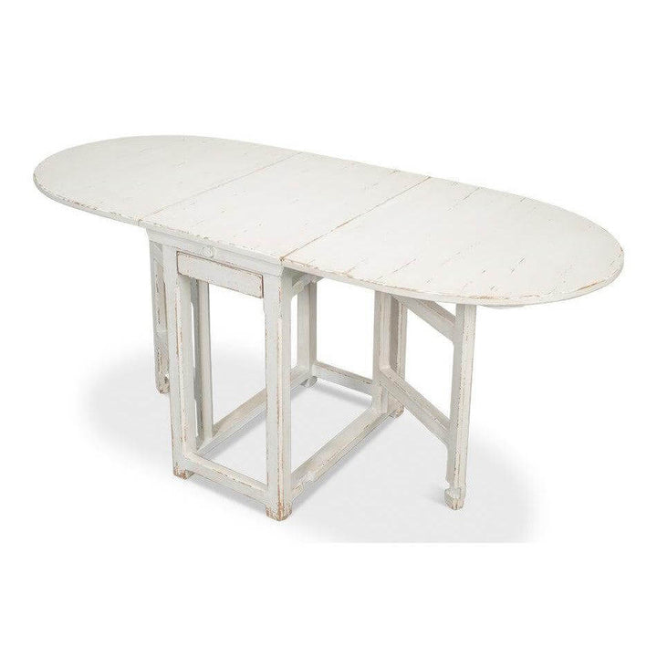 Whitewashed Vintage Dropleaf Table with Distressed Wood Finish in farmhouse style.