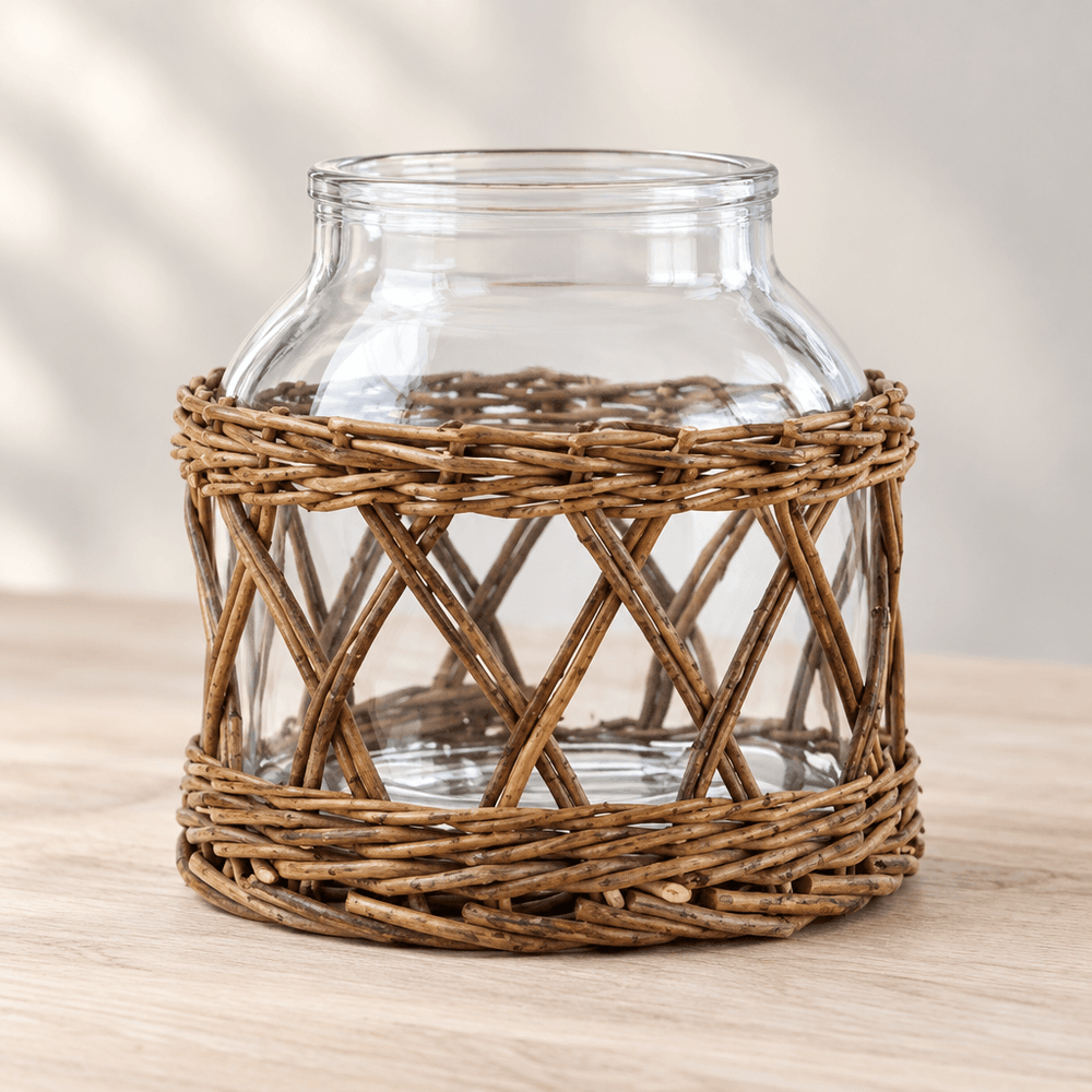Detail of natural willow bands and crisscross lattice around a clear glass vase