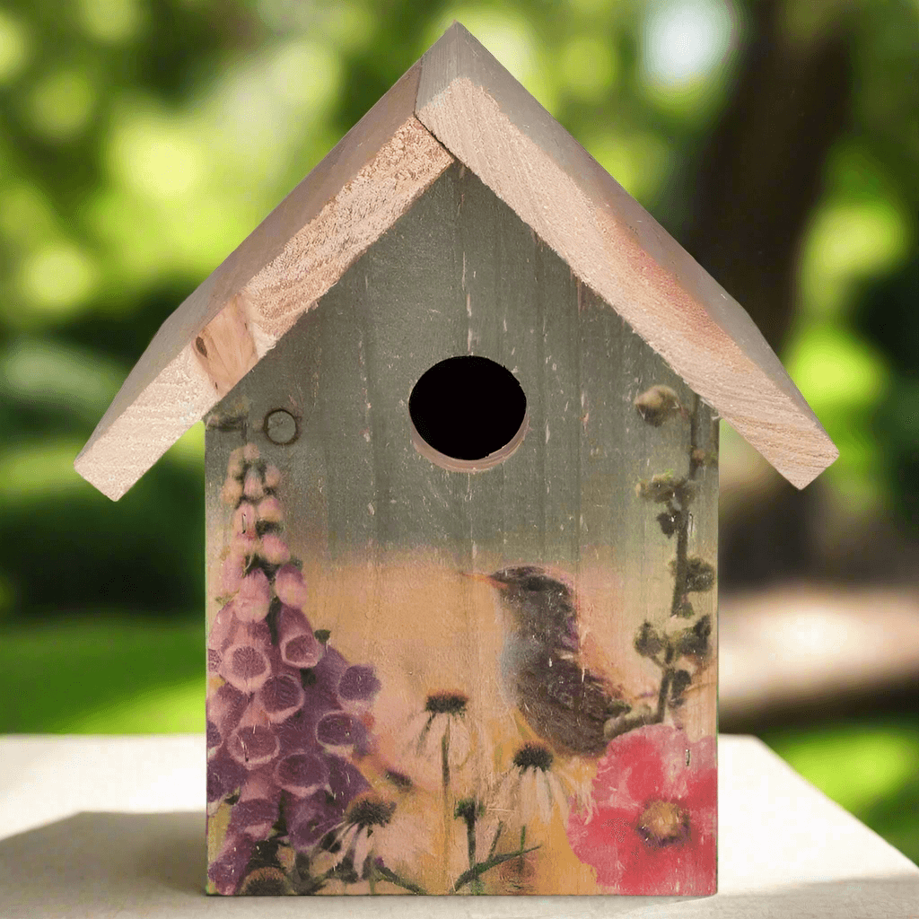 Wooden Birdhouse with Floral Design for Wrens featuring painted wildflowers and a perched bird in a summer garden setting.