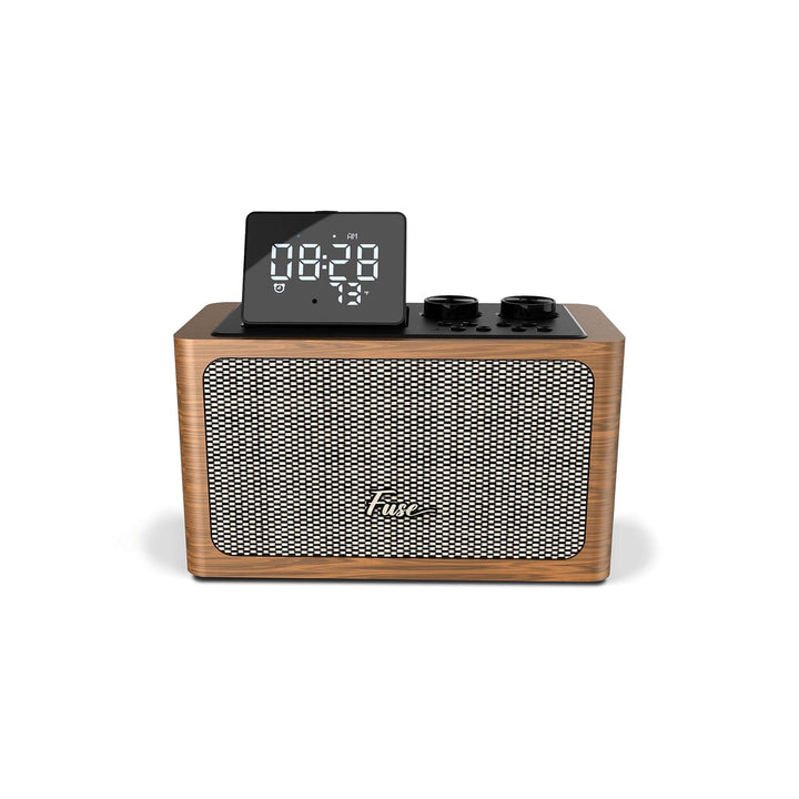 Wooden clock radio with digital display on a white background